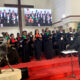 Dr. Milton Wabyona (Back to Camera) conducts the MAKORALE Christmas Concert on 9th December 2021, St. Francis Chapel, Makerere University.